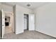 Bright bedroom features neutral carpet, closet, and a glimpse into the home's living spaces at 1234 S Mullberry St, Florence, AZ 85132