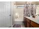 Bright bathroom featuring a shower-tub combo with decorative curtain, ensuring comfortable living at 13212 W Lisbon Ln, Surprise, AZ 85379