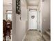 Inviting entryway features neutral walls and tile floor with a white door adorned by a floral wreath at 13212 W Lisbon Ln, Surprise, AZ 85379