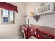 Laundry room featuring a window, an LG washer/dryer, shelving, and a bright color scheme at 13212 W Lisbon Ln, Surprise, AZ 85379