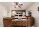 Cozy living room features a fireplace, neutral walls, a ceiling fan, and access to the backyard at 13212 W Lisbon Ln, Surprise, AZ 85379