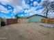 Large backyard with a combination of block and wood fencing, providing space for many outdoor activities at 13805 N 31St Ave, Phoenix, AZ 85053