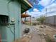 Outdoor backyard featuring lush plants, brick flooring, and a pergola area against the exterior wall at 13805 N 31St Ave, Phoenix, AZ 85053