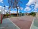 Backyard with a basketball court, trees, and a clear view of the home’s exterior within enclosed fencing at 13805 N 31St Ave, Phoenix, AZ 85053