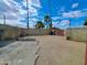 Spacious backyard with block walls and palm trees providing privacy and shade for outdoor activities at 13805 N 31St Ave, Phoenix, AZ 85053