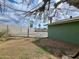 View of the backyard basketball court, block fence, with a partially visible covered patio at 13805 N 31St Ave, Phoenix, AZ 85053