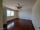 Spacious bedroom with wood floors and large window at 13805 N 31St Ave, Phoenix, AZ 85053