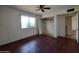 Bedroom with window and ceiling fan at 13805 N 31St Ave, Phoenix, AZ 85053