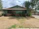 Single-story home showcasing mature trees and a tidy front yard at 13805 N 31St Ave, Phoenix, AZ 85053