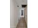 Hallway featuring neutral walls and tile flooring at 13805 N 31St Ave, Phoenix, AZ 85053