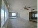 Large living room with ample natural light and a ceiling fan at 13805 N 31St Ave, Phoenix, AZ 85053