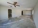 Bright living room with ceiling fans, archways and an open floor plan leading to other rooms at 13805 N 31St Ave, Phoenix, AZ 85053