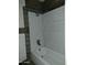 Shower/tub features tiled surround and shower head at 13805 N 31St Ave, Phoenix, AZ 85053