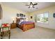 Serene bedroom with a large window and warm wood furniture creating a relaxing retreat at 14124 W Christy Dr, Surprise, AZ 85379