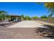 Outdoor sport court adjacent to an outdoor kitchen in a well landscaped backyard at 14124 W Christy Dr, Surprise, AZ 85379