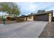 View of the driveway leading up to the home's two-car garage at 14407 N 35Th Pl, Phoenix, AZ 85032