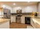 Kitchen features modern stainless steel appliances and granite countertop at 14407 N 35Th Pl, Phoenix, AZ 85032