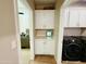 Hallway featuring hallway cabinets, washer, and dryer at 155 N Lakeview Blvd # 207, Chandler, AZ 85225