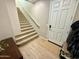 Clean staircase with carpeted steps, offering a practical and neutral design element at 155 N Lakeview Blvd # 207, Chandler, AZ 85225