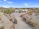 Sprawling desert home offering privacy and panoramic views, surrounded by natural desert landscape and distant mountains at 1550 W Adobe Dam Dr, San Tan Valley, AZ 85144