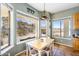 Charming dining area with natural light and views of desert landscaping creating a relaxing space at 1550 W Adobe Dam Dr, San Tan Valley, AZ 85144