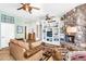 Comfortable living room with a fireplace and built-in shelving, offering a relaxing atmosphere at 1550 W Adobe Dam Dr, San Tan Valley, AZ 85144