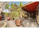 View of the backyard patio and covered area, complete with plants and stone pillars at 15620 N 19Th St, Phoenix, AZ 85022