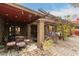 Backyard patio under a pergola, featuring ample seating and decorative lighting at 15620 N 19Th St, Phoenix, AZ 85022