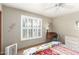 Bedroom with a shuttered window, ceiling fan, and a chest of drawers at 15620 N 19Th St, Phoenix, AZ 85022