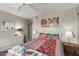 Bright bedroom featuring neutral walls, closet access, and colorful bedding at 15620 N 19Th St, Phoenix, AZ 85022