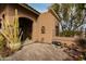 Inviting front porch with desert plants, decorative accents and a decorative door at 15620 N 19Th St, Phoenix, AZ 85022