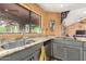 Close up of the kitchen featuring granite counters, a stainless steel sink, and stainless steel appliances at 15620 N 19Th St, Phoenix, AZ 85022