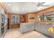 Well-lit kitchen featuring tiled floors, granite countertops, and stainless steel appliances at 15620 N 19Th St, Phoenix, AZ 85022