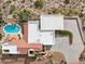 Aerial view of estate featuring a pool, pergola, manicured landscape, and unique desert surroundings at 16611 E Inca Ave, Fountain Hills, AZ 85268