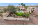 Expansive desert property with a pool, lush greenery, mature trees, and privacy fencing at 16611 E Inca Ave, Fountain Hills, AZ 85268