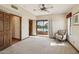 Inviting bedroom with a ceiling fan and sliding glass doors that showcase a stunning view of the outdoor pool at 16611 E Inca Ave, Fountain Hills, AZ 85268