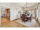 Dining room with chandelier lighting and view to the kitchen at 16611 E Inca Ave, Fountain Hills, AZ 85268