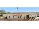 Expansive single-story home showcasing desert landscaping and a red tile roof against a clear blue sky at 16611 E Inca Ave, Fountain Hills, AZ 85268