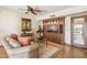 Cozy living room with built-in wooden cabinets and ceiling fan at 16611 E Inca Ave, Fountain Hills, AZ 85268