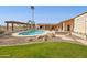 Gorgeous backyard with a stunning pool, boulders and beautiful green lawn at 16611 E Inca Ave, Fountain Hills, AZ 85268