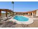 Inviting backyard pool with pergola, desert landscaping, and beautiful tile, perfect for outdoor relaxation and entertainment at 16611 E Inca Ave, Fountain Hills, AZ 85268