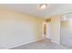 Bedroom featuring plush carpeting, neutral paint, and a mirrored closet at 17025 W Rimrock St, Surprise, AZ 85388