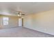 Bedroom featuring plush carpeting, neutral paint, and a ceiling fan at 17025 W Rimrock St, Surprise, AZ 85388