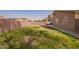 Backyard featuring grass, block wall fencing, and desert landscaping at 1756 E Cardinal Dr, Casa Grande, AZ 85122