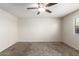 Large primary bedroom featuring a ceiling fan, carpet flooring and natural light at 1756 E Cardinal Dr, Casa Grande, AZ 85122