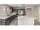 Kitchen featuring stainless steel appliances, gray cabinets and a marble countertop island at 1756 E Cardinal Dr, Casa Grande, AZ 85122