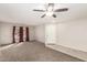 Inviting living room featuring plush carpet, natural light from window, and stylish light fixtures at 1756 E Cardinal Dr, Casa Grande, AZ 85122