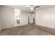 Spacious main bedroom with neutral carpet and adjoined bathroom at 1756 E Cardinal Dr, Casa Grande, AZ 85122