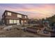Expansive backyard featuring raised garden beds, playhouse, and covered patio for outdoor relaxation and enjoyment at 1805 E Aloe Pl, Chandler, AZ 85286