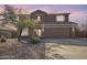 Inviting two-story home featuring a neutral color palette, well-maintained landscaping, and a spacious two-car garage at 1805 E Aloe Pl, Chandler, AZ 85286